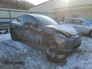 2023 Tesla Model Y Long Range with VIN 7SAYGDEE6PF752570, listed as a Copart auction lot 84927794 with 52,297 mi miles and Salvage Title. Bid and sale history available at DreamBid. Image 4.