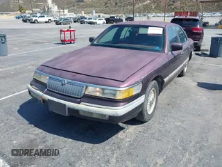1992 Mercury Grand Marquis LS z VIN 2MECM75W4NX749141, wystawiony jako IAAI lot #42413769 z przebiegiem 296 805 mil mil oraz . Historia ofert i sprzedaży dostępna na DreamBid. Obrazek 2.