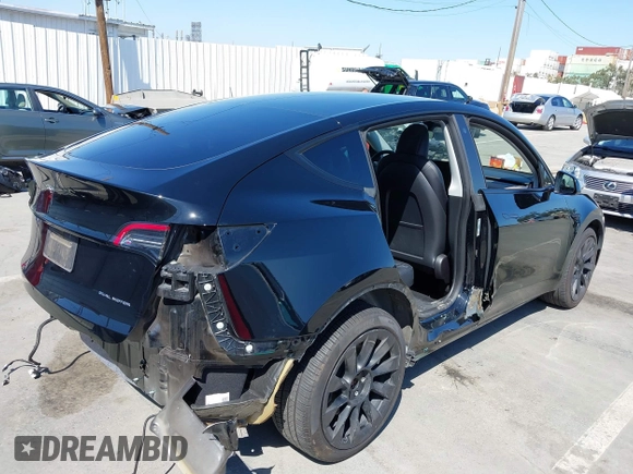 2022 Tesla Model Y Long Range with VIN 7SAYGDEE6NF480471, listed as a IAAI auction lot 41985797 with 82,777 mi miles and . Bid and sale history available at DreamBid. Image 4.