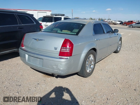 2006 Chrysler 300 C with VIN 2C3KA63H46H154990, listed as a IAAI auction lot 42004790 with 233,673 mi miles. Bid and sale history available at carsss.com. Image 4.