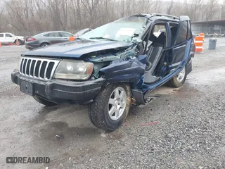 2002 Jeep Grand Cherokee Laredo with VIN 1J4GW48S82C321712, listed as a IAAI auction lot 41855809 with 1 mi miles. Bid and sale history available at carsss.com. Image 2.