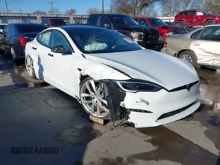 2022 Tesla Model S Plaid with VIN 5YJSA1E63NF483873, listed as a IAAI auction lot 41204003 with 15 mi miles and . Bid and sale history available at carsss.com. Image 1.