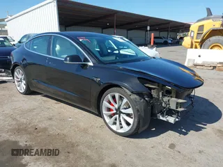 2019 Tesla Model 3 Long Range with VIN 5YJ3E1EB9KF231742, listed as a IAAI auction lot 42114608 with 86,657 mi miles and . Bid and sale history available at carsss.com. Image 1.