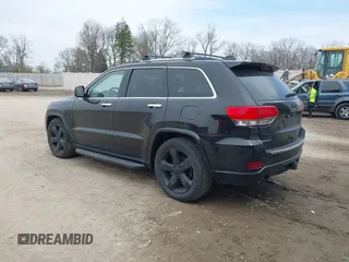 2014 Jeep Grand Cherokee Overland with VIN 1C4RJFCM8EC486259, listed as a IAAI auction lot 42105296 with 129,342 mi miles. Bid and sale history available at carsss.com. Image 3.