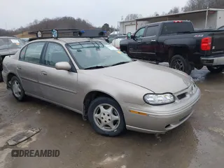 1999 Oldsmobile Cutlass GL z VIN 1G3NB52J8X6318863, wystawiony jako IAAI lot #41490091 z przebiegiem 106 821 mil mil oraz . Historia ofert i sprzedaży dostępna na DreamBid. Obrazek 1.