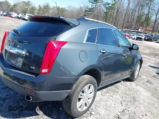 2015 Cadillac SRX Luxury Collection with VIN 3GYFNBE36FS537297, listed as a IAAI auction lot 41733421 with 147,336 mi miles. Bid and sale history available at carsss.com. Image 4.