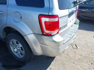 2010 Ford Escape Limited with VIN 1FMCU9EG8AKB12610, listed as a IAAI auction lot 41834872 with 214,218 mi miles. Bid and sale history available at carsss.com. Image 6.
