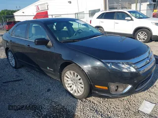 2012 Ford Fusion Hybrid z VIN 3FADP0L35CR371734, wystawiony jako IAAI lot #42559033 z przebiegiem 131 314 mil mil oraz . Historia ofert i sprzedaży dostępna na DreamBid. Obrazek 1.