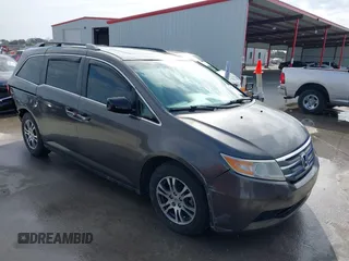 2012 Honda Odyssey EX-L with VIN 5FNRL5H60CB094682, listed as a IAAI auction lot 41570797 with 127,890 mi miles and . Bid and sale history available at carsss.com. Image 1.