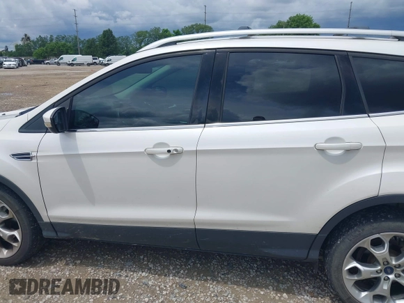 2016 Ford Escape Titanium z VIN 1FMCU9J90GUC76504, wystawiony jako IAAI lot #42552851 z przebiegiem 89 570 mil mil oraz . Historia ofert i sprzedaży dostępna na DreamBid. Obrazek 15.