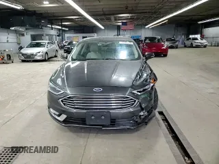2017 Ford Fusion Titanium z VIN 3FA6P0SU3HR209563, wystawiony jako Copart lot #52039915 z przebiegiem 119 961 mil mil oraz Szkoda całkowita • Salvage title. Historia ofert i sprzedaży dostępna na DreamBid. Obrazek 11.