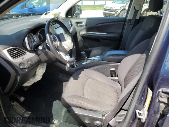 2013 Dodge Journey SXT with VIN 3C4PDCCG1DT637534, listed as a Copart auction lot 56992205 with 128,531 mi miles and Clean title. Bid and sale history available at DreamBid. Image 7.