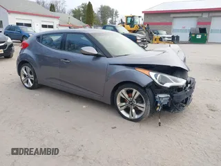 2014 Hyundai Veloster with VIN KMHTC6AD5EU183478, listed as a IAAI auction lot 42107170 with 64,905 mi miles. Bid and sale history available at carsss.com. Image 1.