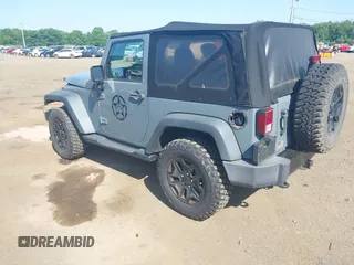 2015 Jeep Wrangler Freedom Edition with VIN 1C4AJWAG1FL714002, listed as a IAAI auction lot 42579024 with 98,732 mi miles and . Bid and sale history available at DreamBid. Image 3.
