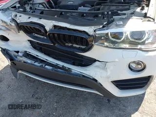2015 BMW X4 xDrive28i with VIN 5UXXW3C59F0M88331, listed as a IAAI auction lot 42093953 with 138,205 mi miles and . Bid and sale history available at DreamBid. Image 6.