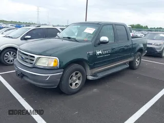 2002 Ford F-150 XLT with VIN 1FTRW07L82KB04538, listed as a IAAI auction lot 42104767 with Not Provided miles and . Bid and sale history available at DreamBid. Image 2.
