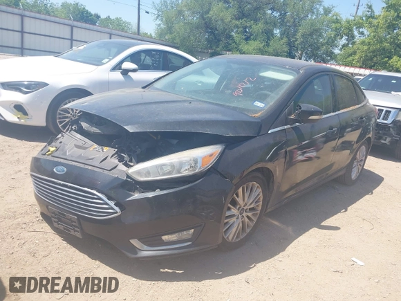 2015 Ford Focus Titanium with VIN 1FADP3J24FL385526, listed as a IAAI auction lot 42011712 with 162,696 mi miles and . Bid and sale history available at carsss.com. Image 2.