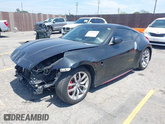 2015 Nissan 370Z Sport with VIN JN1AZ4EH3FM441836, listed as a IAAI auction lot 42094959 with 59,004 mi miles and . Bid and sale history available at DreamBid. Image 2.