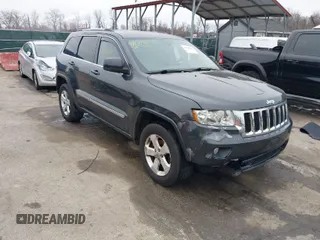 2013 Jeep Grand Cherokee Laredo with VIN 1C4RJFAG9DC506238, listed as a IAAI auction lot 41800981 with 172,676 mi miles. Bid and sale history available at carsss.com. Image 1.