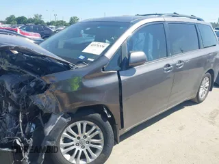 2014 Toyota Sienna XLE with VIN 5TDYK3DC4ES419928, listed as a IAAI auction lot 41976538 with 144,405 mi miles. Bid and sale history available at carsss.com. Image 1.