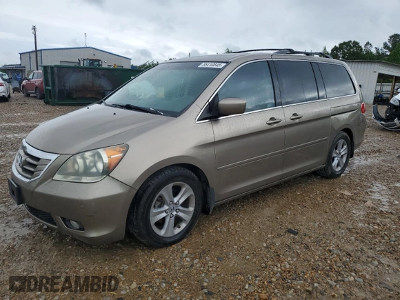 2010 Honda Odyssey Touring z VIN 5FNRL3H97AB082525, wystawiony jako Copart lot #56410845 z przebiegiem 94 819 mil mil oraz Szkoda całkowita • Salvage title. Historia ofert i sprzedaży dostępna na DreamBid. Obrazek 1.