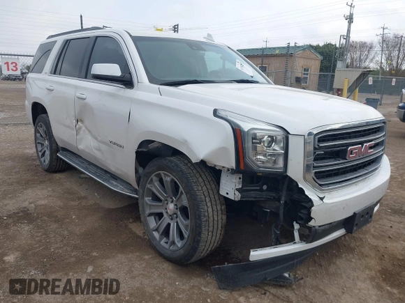 2019 GMC Yukon SLT with VIN 1GKS1BKCXKR329607, listed as a IAAI auction lot 41188239 with 84,940 mi miles. Bid and sale history available at carsss.com. Image 1.