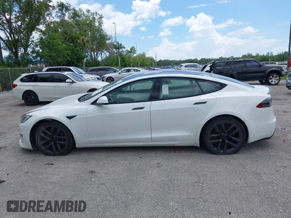 2022 Tesla Model S Plaid with VIN 5YJSA1E61NF460155, listed as a IAAI auction lot 42545167 with 51,711 mi miles and . Bid and sale history available at DreamBid. Image 14.