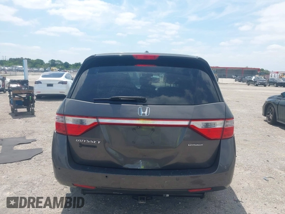 2012 Honda Odyssey Touring with VIN 5FNRL5H90CB088536, listed as a IAAI auction lot 42102008 with 283,350 mi miles and . Bid and sale history available at DreamBid. Image 16.