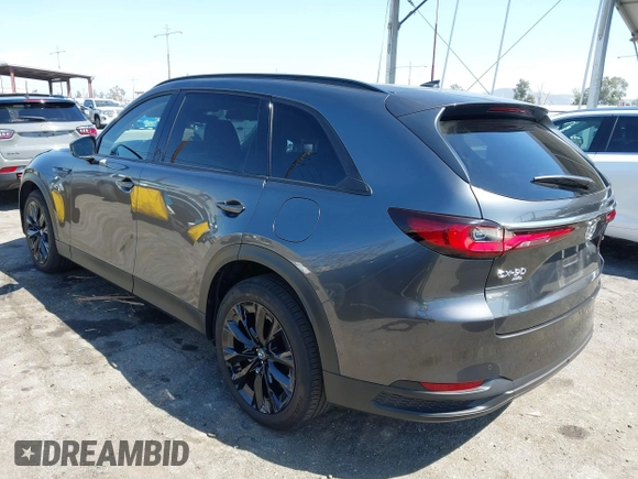 2025 Mazda CX-90 Premium Sport z VIN JM3KKCHAXS1206996, wystawiony jako IAAI lot #42086590 z przebiegiem 4 294 mil mil oraz . Historia ofert i sprzedaży dostępna na DreamBid. Obrazek 3.