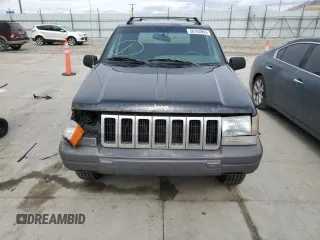 1996 Jeep Grand Cherokee with VIN 1J4EZ58S8TC106529, listed as a Copart auction lot 50163965 with 226,951 mi miles and Salvage title. Bid and sale history available at DreamBid. Image 5.