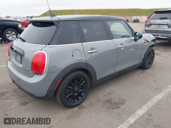 2015 MINI Hardtop 4 Door with VIN WMWXS5C52FT829699, listed as a IAAI auction lot 42078187 with 59,641 mi miles and . Bid and sale history available at DreamBid. Image 4.