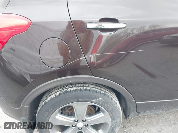 2013 Buick Encore Leather with VIN KL4CJCSB0DB144646, listed as a IAAI auction lot 41668384 with 122,082 mi miles and . Bid and sale history available at carsss.com. Image 12.