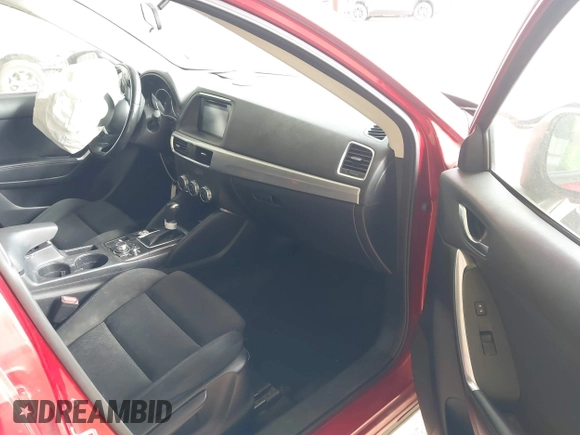 2016 Mazda CX-5 Touring with VIN JM3KE2CY0G0691927, listed as a IAAI auction lot 41611743 with 160,246 mi miles. Bid and sale history available at carsss.com. Image 5.