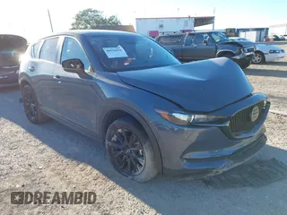2021 Mazda CX-5 Touring with VIN JM3KFACM1M0371354, listed as a IAAI auction lot 40938490 with 56,172 mi miles. Bid and sale history available at carsss.com. Image 1.