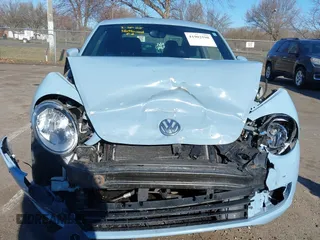 2014 Volkswagen Beetle 2.5L w/Sun with VIN 3VWJP7AT6EM601318, listed as a IAAI auction lot 41902598 with 169,220 mi miles and . Bid and sale history available at DreamBid. Image 12.