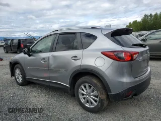 2014 Mazda CX-5 Touring z VIN JM3KE4CY0E0407169, wystawiony jako Copart lot #57877215 z przebiegiem 168 277 mil mil oraz Szkoda całkowita • Salvage title. Historia ofert i sprzedaży dostępna na DreamBid. Obrazek 2.