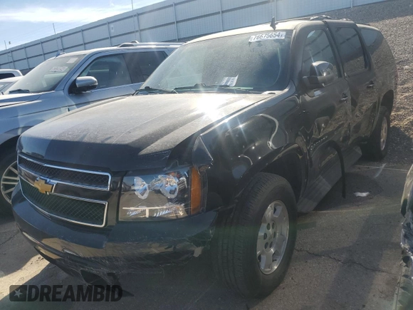 2014 Chevrolet Suburban LT with VIN 1GNSKJE71ER227075, listed as a Copart auction lot 76675654 with 214,113 mi miles and Salvage Title. Bid and sale history available at DreamBid. Image 1.