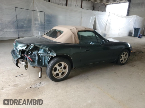 1999 Mazda MX-5 Miata z VIN JM1NB353XX0111850, wystawiony jako Copart lot #53076805 z przebiegiem 128 707 mil mil oraz Szkoda całkowita • Salvage title. Historia ofert i sprzedaży dostępna na DreamBid. Obrazek 3.