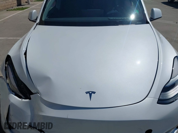 2023 Tesla Model Y Long Range with VIN 7SAYGDEE2PF696336, listed as a IAAI auction lot 41894686 with 34,203 mi miles. Bid and sale history available at carsss.com. Image 10.