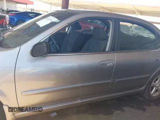 2003 Nissan Maxima SE z VIN JN1DA31D43T512898, wystawiony jako IAAI lot #42111179 z przebiegiem 210 817 mil mil oraz . Historia ofert i sprzedaży dostępna na DreamBid. Obrazek 14.