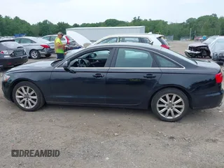 2014 Audi A6 Premium Plus z VIN WAUGFAFC2EN112438, wystawiony jako IAAI lot #42498202 z przebiegiem 145 794 mil mil oraz . Historia ofert i sprzedaży dostępna na DreamBid. Obrazek 14.