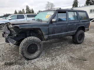 1988 Jeep Grand Cherokee with VIN 1JCMT7895JT247338, listed as a Copart auction lot 83615234 with 185,676 mi miles and Salvage title. Bid and sale history available at DreamBid. Image 1.