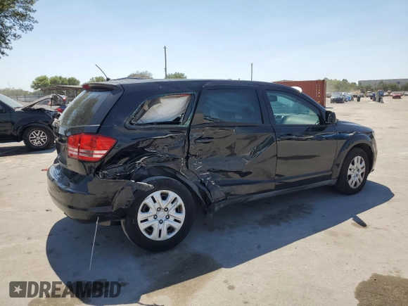 2013 Dodge Journey American Value with VIN 3C4PDCAB6DT709996, listed as a Copart auction lot 52362635 with 104,808 mi miles and Salvage Title. Bid and sale history available at DreamBid. Image 3.