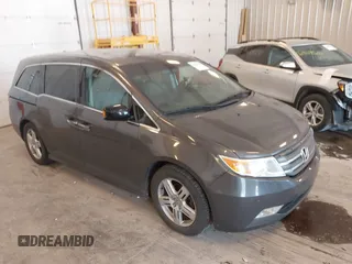 2012 Honda Odyssey Touring with VIN 5FNRL5H94CB054485, listed as a IAAI auction lot 42482324 with 211,725 mi miles and . Bid and sale history available at DreamBid. Image 1.