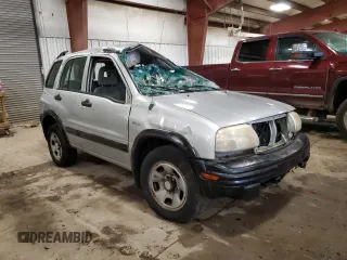 2004 Suzuki Vitara JX z VIN 2S3TD52V546100133, wystawiony jako Copart lot #72629154 z przebiegiem 186 597 mil mil oraz Tytuł czysty. Historia ofert i sprzedaży dostępna na DreamBid. Obrazek 4.