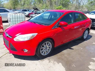 2012 Ford Focus SE z VIN 1FAHP3F23CL333598, wystawiony jako IAAI lot #41970172 z przebiegiem 209 969 mil mil oraz . Historia ofert i sprzedaży dostępna na DreamBid. Obrazek 2.