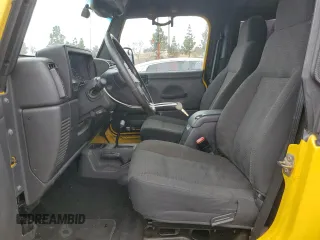 2004 Jeep Wrangler Rubicon with VIN 1J4FA69SX4P768963, listed as a Copart auction lot 56999665 with 91,949 mi miles and Salvage title. Bid and sale history available at DreamBid. Image 7.