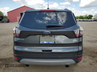 2017 Ford Escape SE z VIN 1FMCU0GD5HUA67154, wystawiony jako Copart lot #58474105 z przebiegiem 129 896 mil mil oraz Czysty tytuł • Clean title. Historia ofert i sprzedaży dostępna na DreamBid. Obrazek 6.