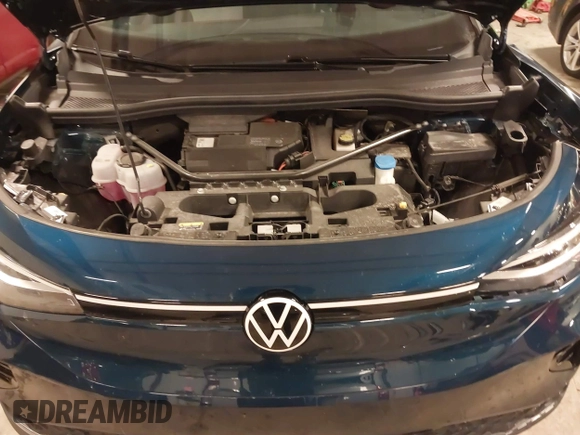 2023 Volkswagen ID.4 Pro z VIN 1V2DNPE84PC038042, wystawiony jako IAAI lot #41446269 z przebiegiem 12 878 mil mil oraz . Historia ofert i sprzedaży dostępna na DreamBid. Obrazek 10.
