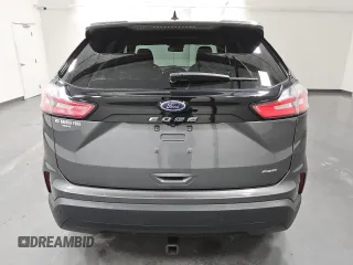 2021 Ford Edge SE z VIN 2FMPK4G95MBA23228, wystawiony jako Copart lot #51947405 z przebiegiem 80 522 mil mil oraz Czysty tytuł • Clean title. Historia ofert i sprzedaży dostępna na DreamBid. Obrazek 6.